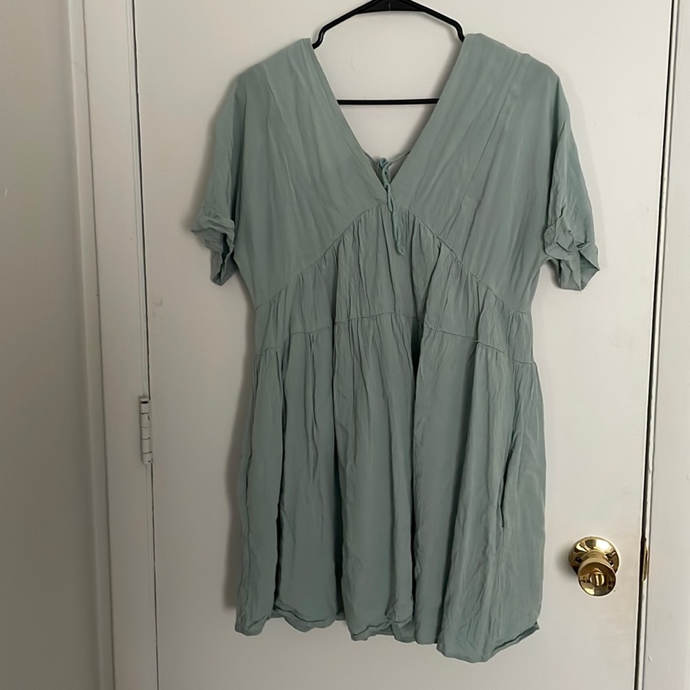 Light green/mint, Size M, worn once (wrinkled from the wash)